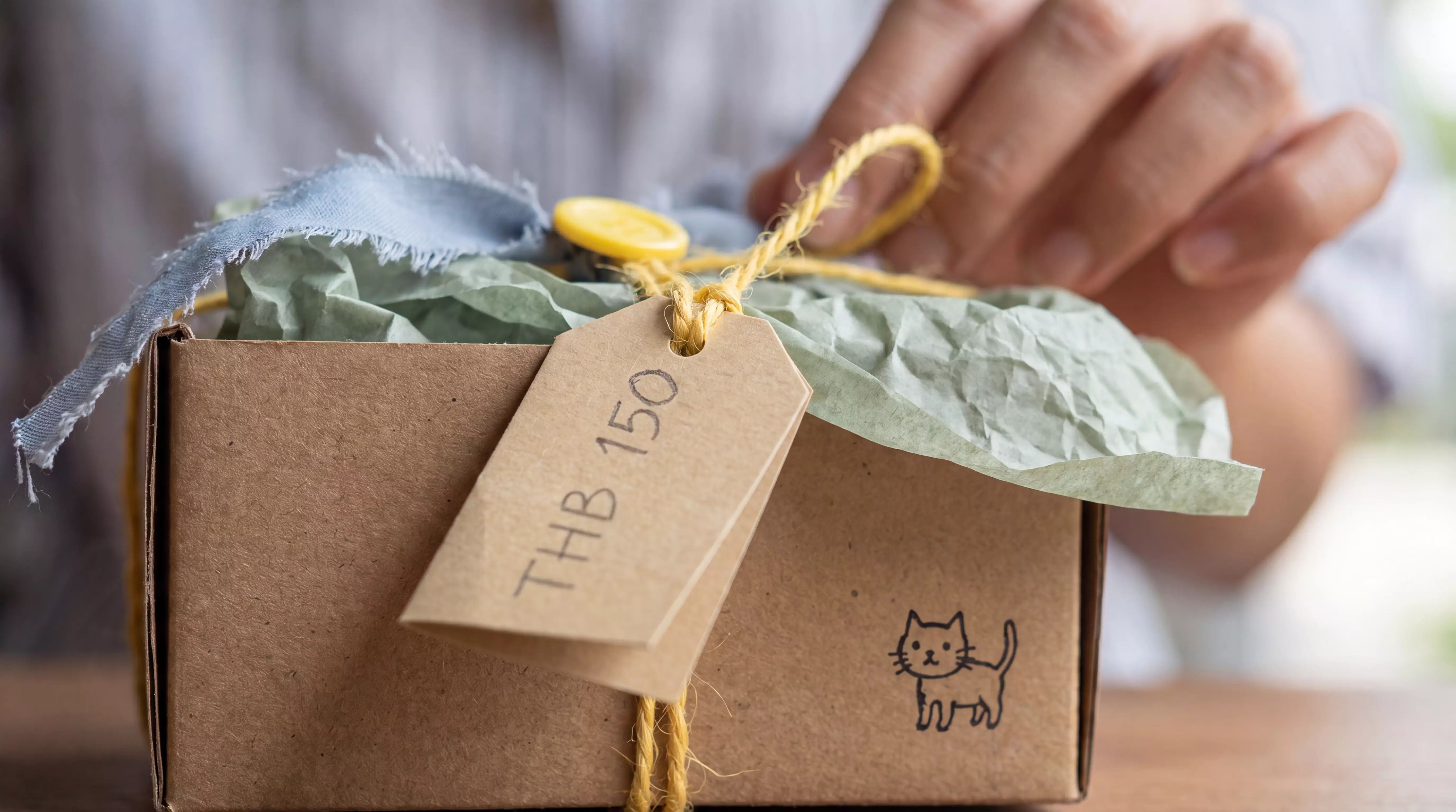Box with a hand-drawn cat doodle