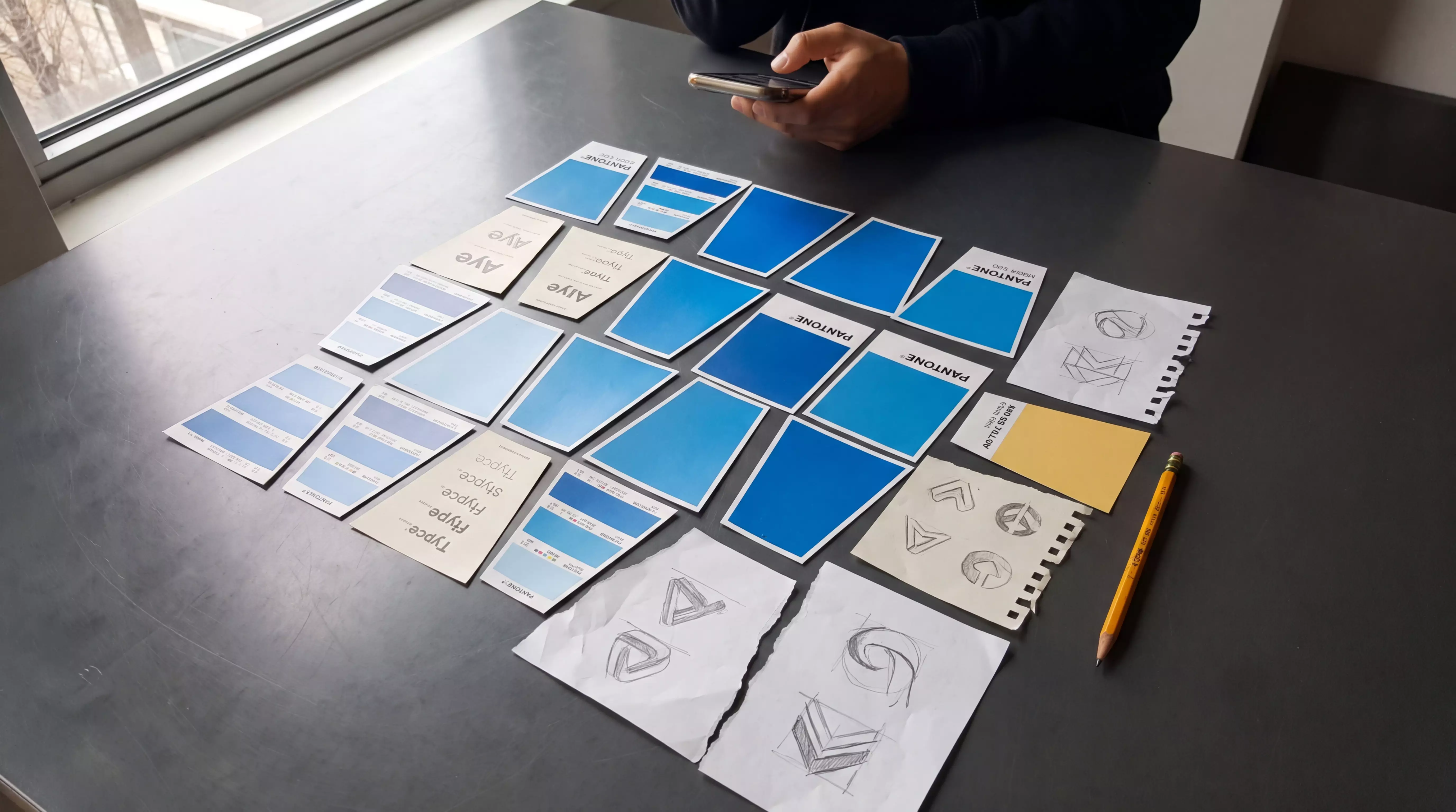 Brand moodboard in progress on a desk