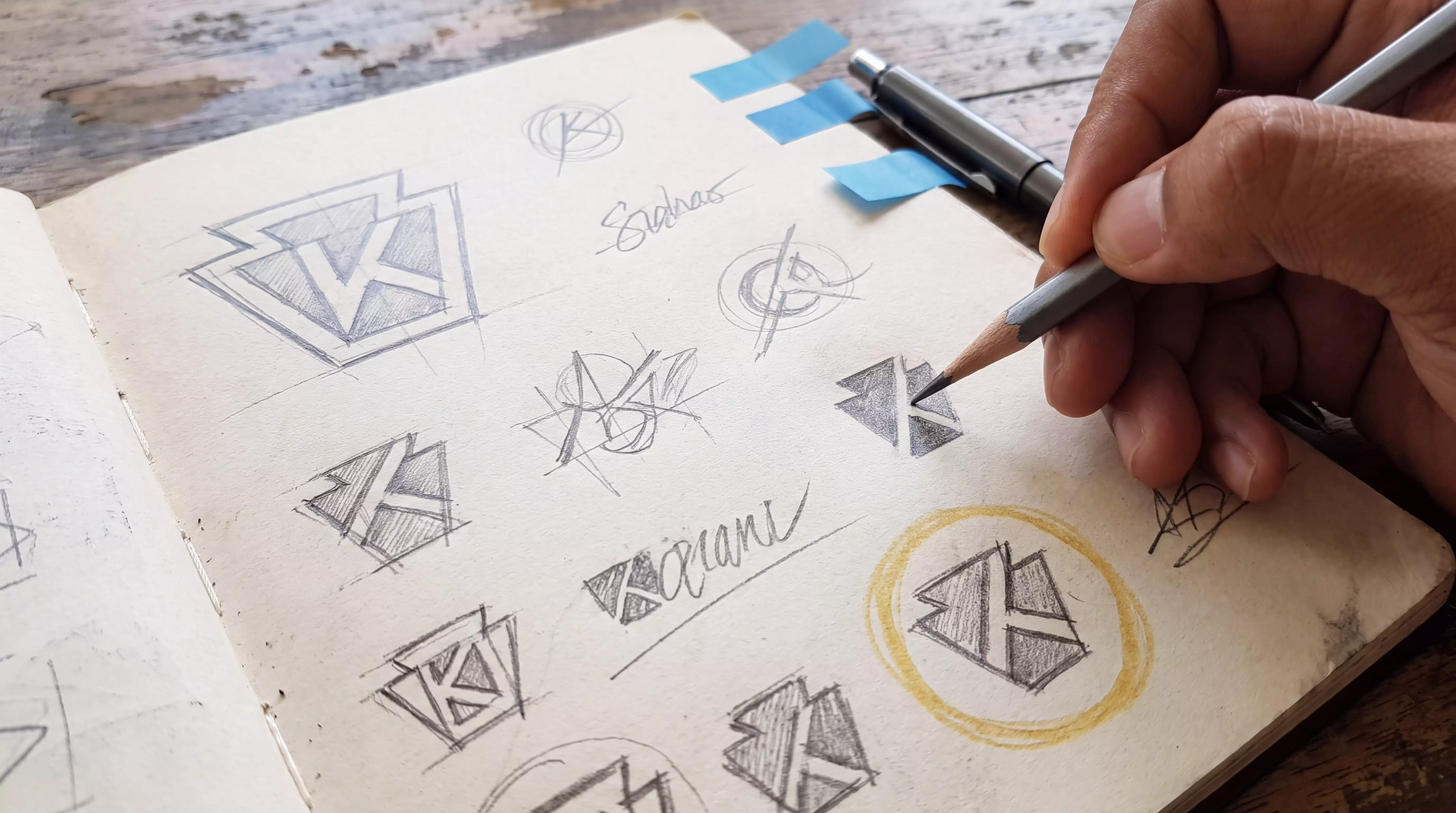 Hand shading logo iteration sketches