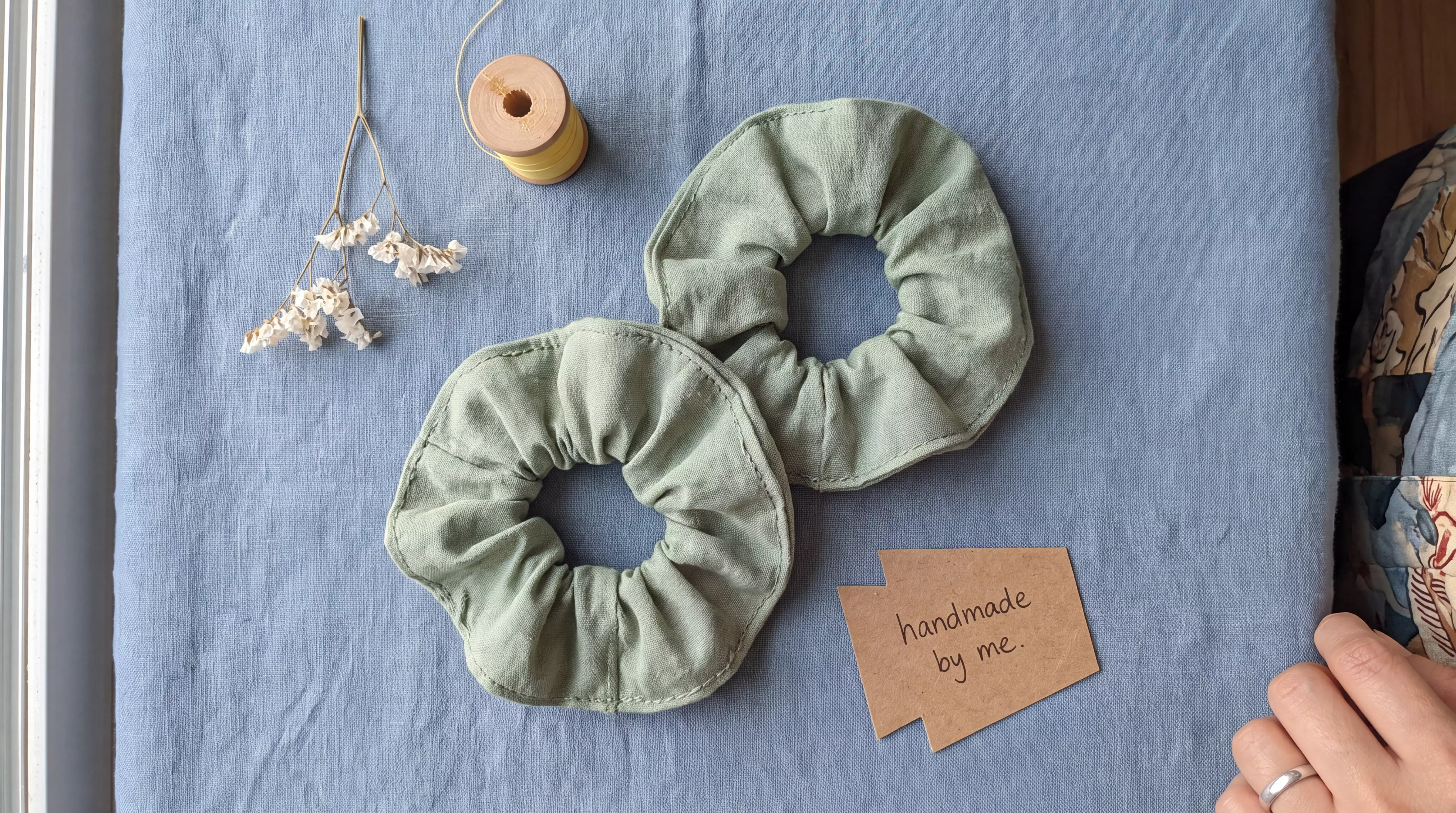 Scrunchies on a blue linen backdrop